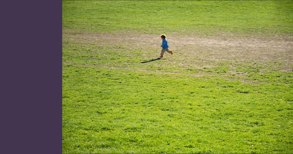 boy runs across field - child photography brooklyn