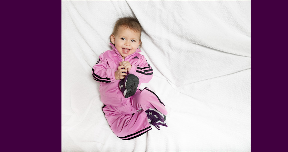 baby girl on bed - child and family photography half moon bay