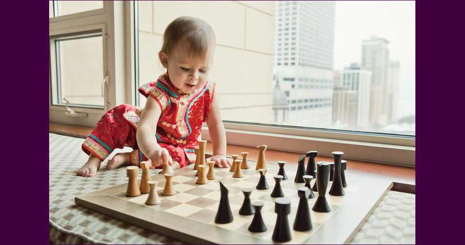 little girl playing chess - family photographer san jose